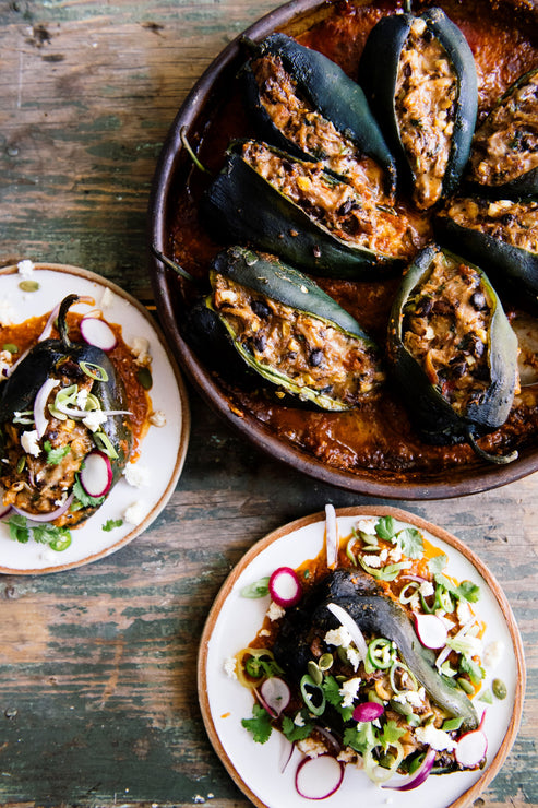 Load image into Gallery viewer, Stuffed poblano peppers made with Pumpkin Seed Salsa