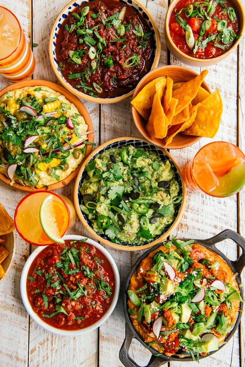 Load image into Gallery viewer, A colorful arrangement of dips, salsas, chips and margaritas