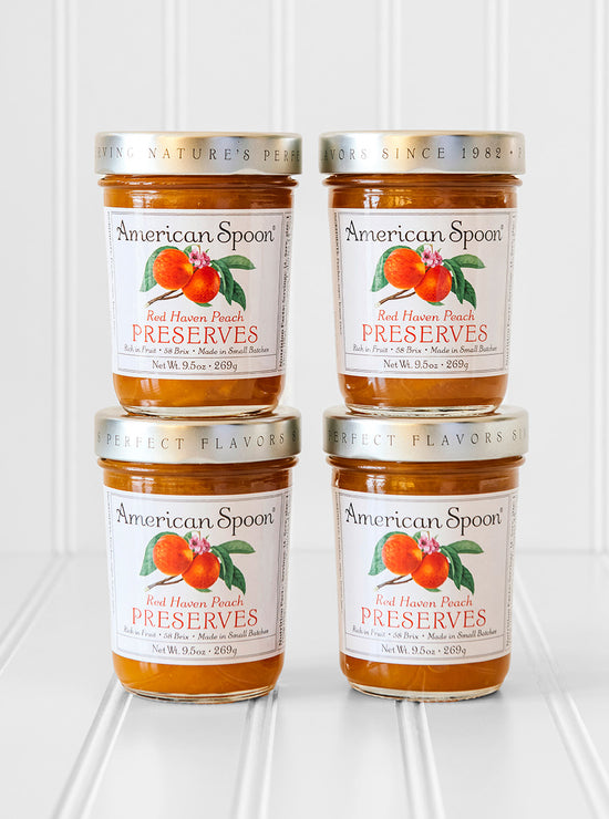 Load image into Gallery viewer, A stack of four jars of Red Haven Peach Preserves
