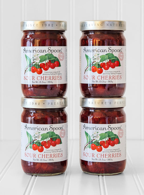 Load image into Gallery viewer, A stack of four jars of Fruit Perfect Sour Cherries