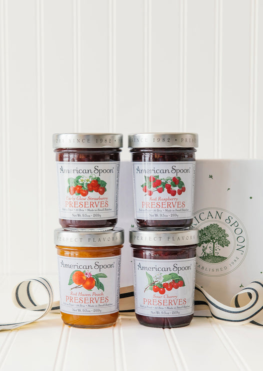 Load image into Gallery viewer, The preserve quartet gift box including early glow strawberry preserves, sour cherry preserves, red haven peach preserves, red raspberry preserves and a gift box