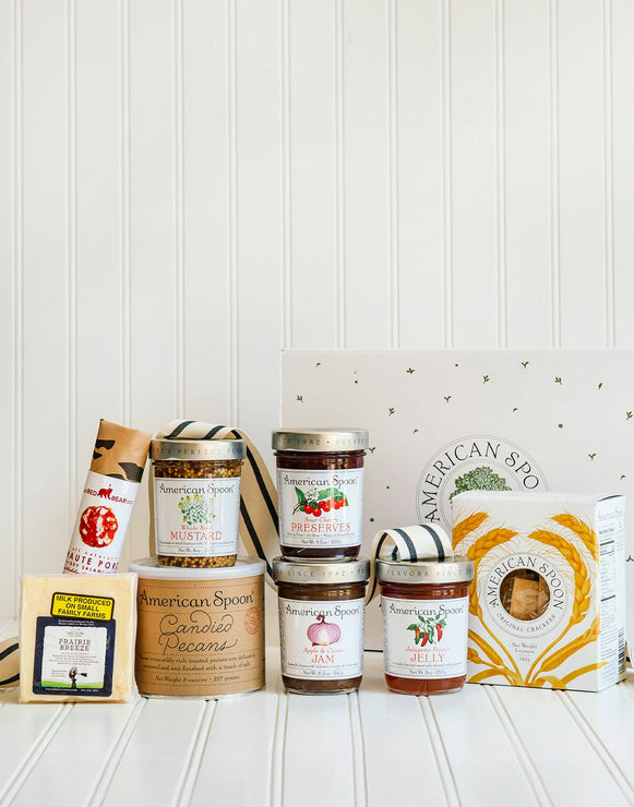 Load image into Gallery viewer, The Entertainer gift including Haute Porc Salami, Prairie Breeze Cheese, Whole Seed Mustard, 8 oz Candied Pecans, Sour Cherry Preserves, Apple & Onion Jam, Jalapeno Pepper Jelly, American Spoon Original Crackers and a gift box