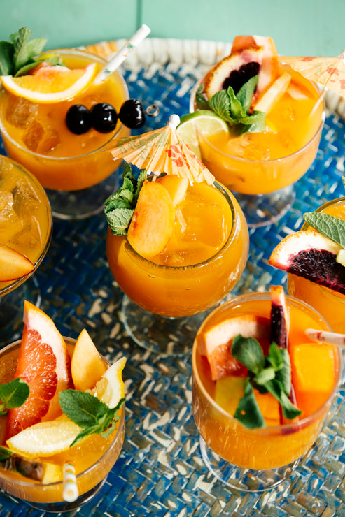 Load image into Gallery viewer, a platter of summer cocktails with fresh fruit garnishes