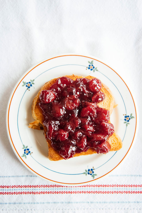 Load image into Gallery viewer, A slice of toast topped with Fruit Perfect Sour Cherries
