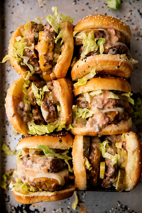 Load image into Gallery viewer, Burgers topped with lettuce and pickles