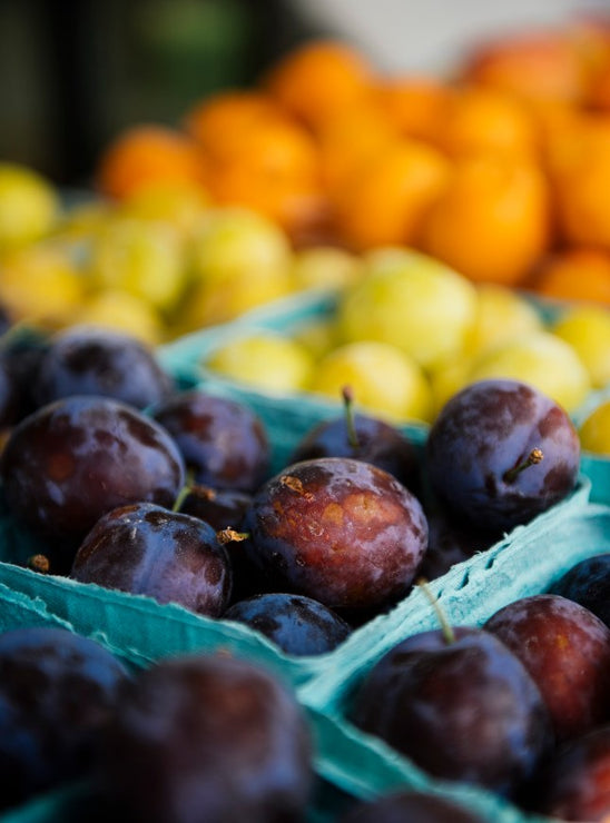 Load image into Gallery viewer, Pints of ripe plums and apricots
