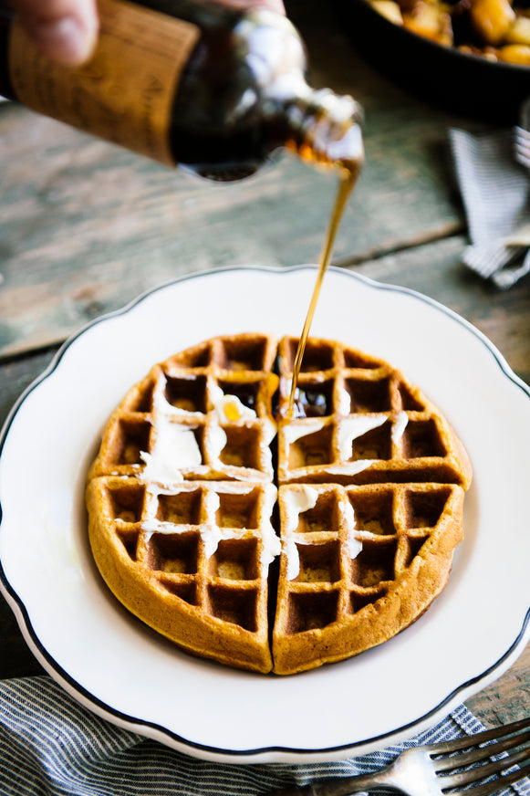 a waffle topped with Maple Syrup