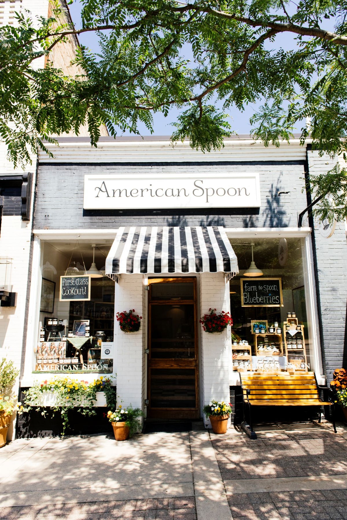 The front door of the Petoskey, Michigan American Spoon retail store on a sunny summer day.