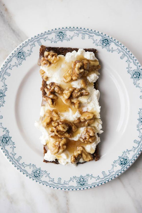 Load image into Gallery viewer, a piece of toast topped with ricotta, star thistle honey and walnuts
