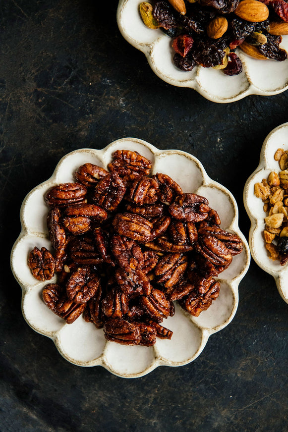 bowls of merry mix, candied pecans and maple granola