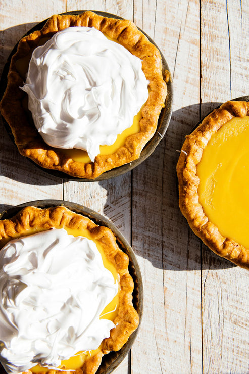 Load image into Gallery viewer, homemade curd tarts topped with fresh whipped cream
