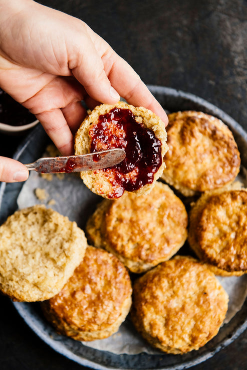 Load image into Gallery viewer, open face biscuits topped with preserves and butter
