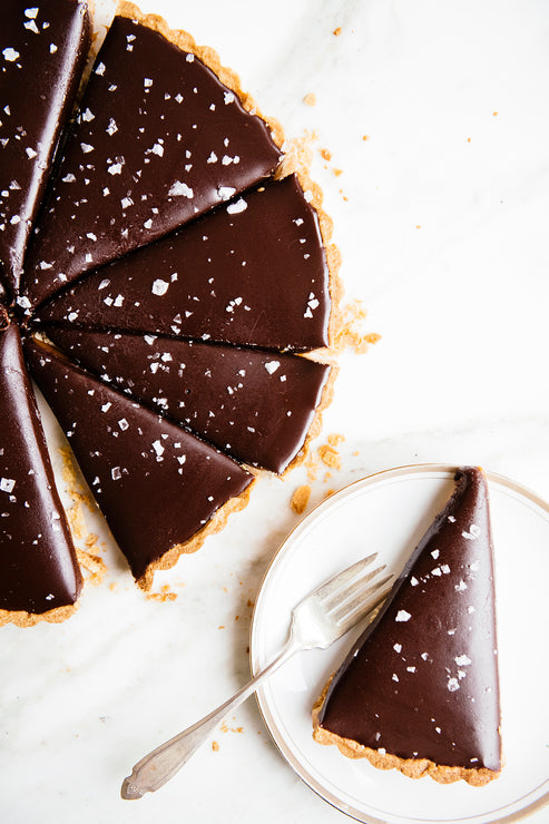 Load image into Gallery viewer, homemade fudge tart topped with sea salt flakes
