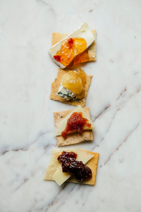 Load image into Gallery viewer, crackers topped with various cheeses and preserves
