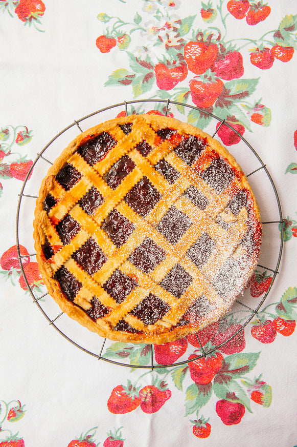 a homemade strawberry tart with a lattice topping