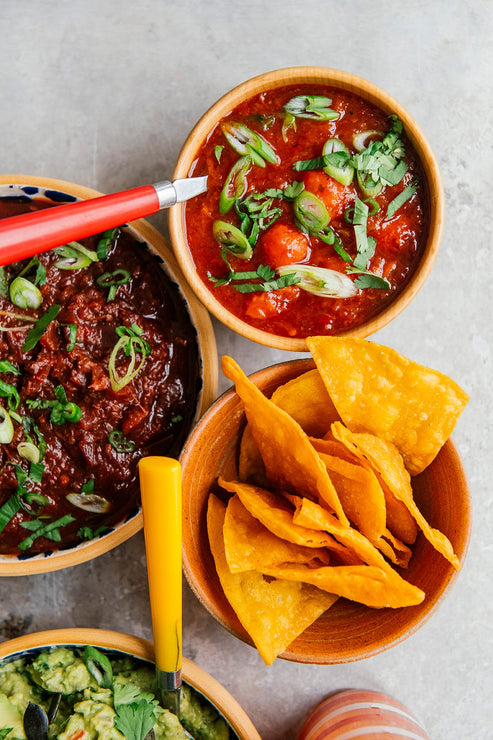 Load image into Gallery viewer, an array of salsa and guacamole
