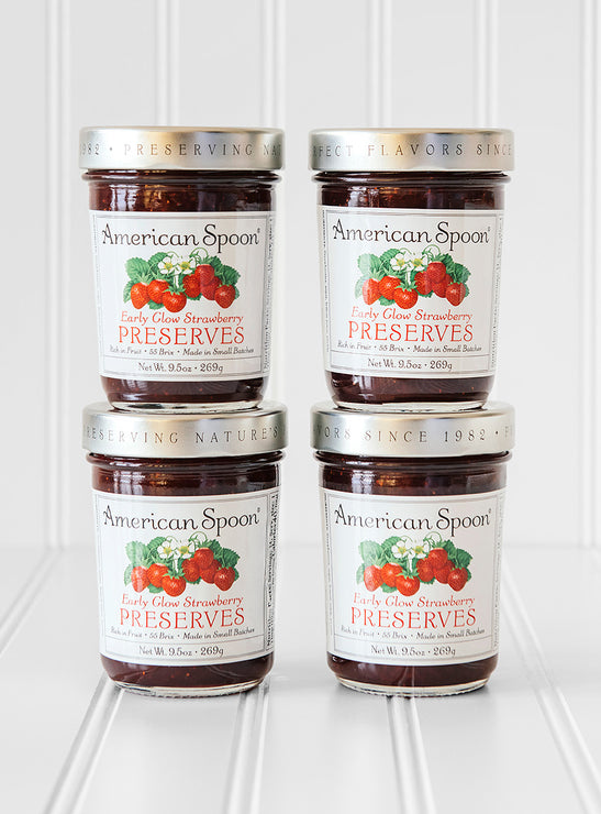 Load image into Gallery viewer, A stack of four jars of Early Glow Strawberry Preserves
