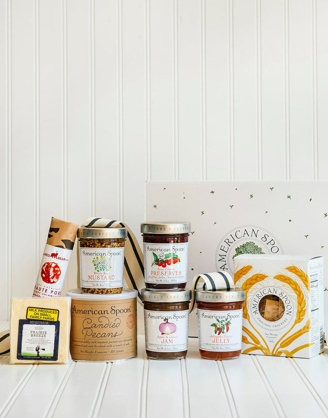 The Entertainer gift including Haute Porc Salami, Prairie Breeze Cheese, Whole Seed Mustard, 8 oz Candied Pecans, Sour Cherry Preserves, Apple & Onion Jam, Jalapeno Pepper Jelly, American Spoon Original Crackers and a gift box