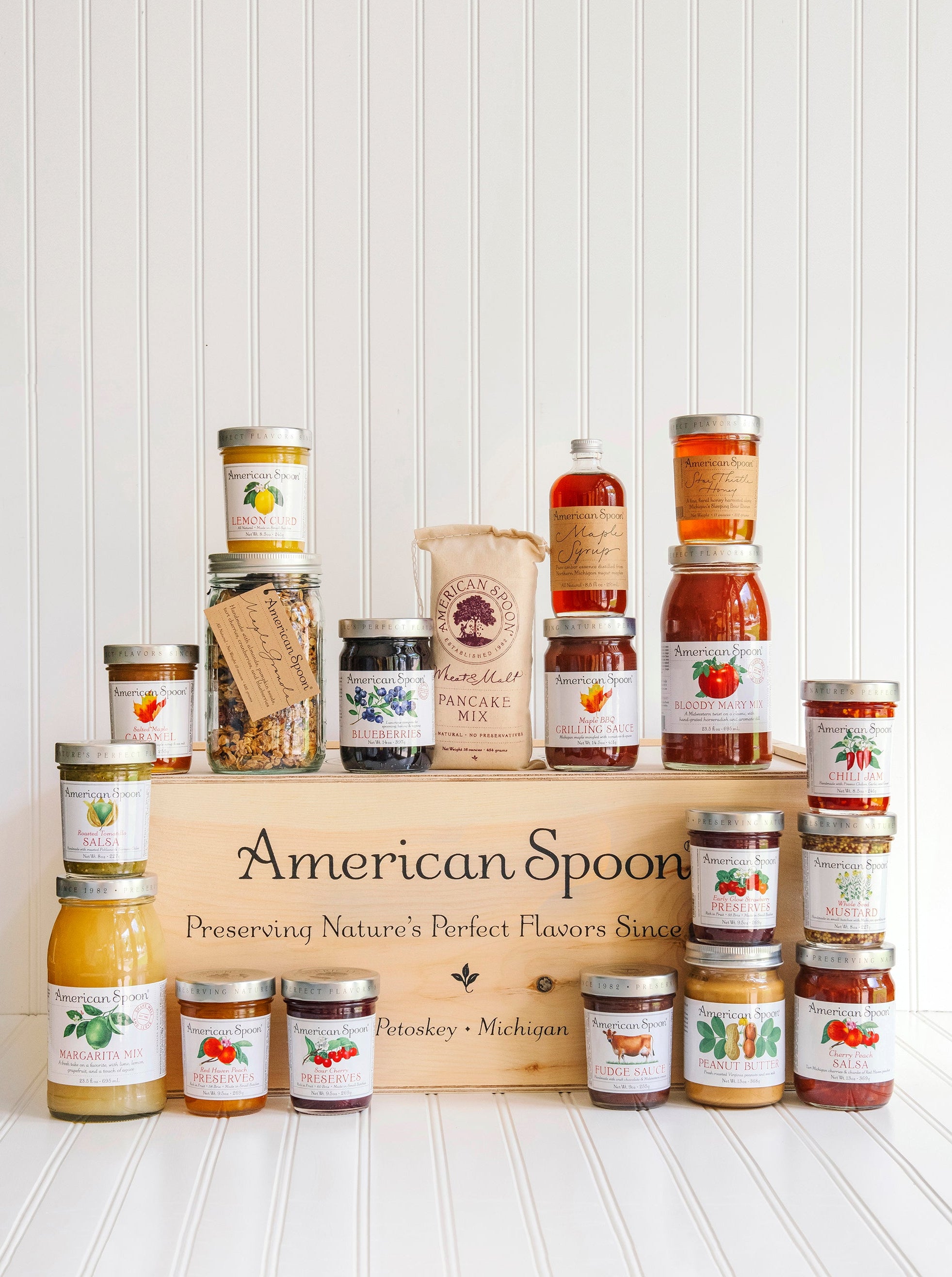 the Buy the Store gift box with products stacked around an american spoon gift crate