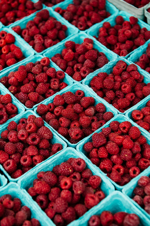 Load image into Gallery viewer, farm market containers of fresh red raspberries

