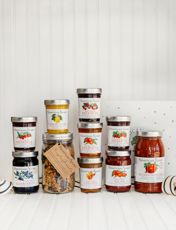 Load image into Gallery viewer, A collection of American Spoon bestsellers: Fruit Perfect Blueberries, Sour Cherry Preserves, Lemon Curd, Maple Granola, Red Raspberry Preserves, Red Haven Peach Preserves, Salted Maple Caramel, Early Glow Strawberry Preserves, Cherry-Peach Salsa, and Bloody Mary Mix
