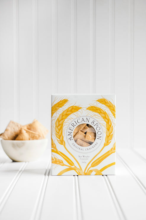 Load image into Gallery viewer, American Spoon original crackers box on a white surface with a bowl of crackers in the background
