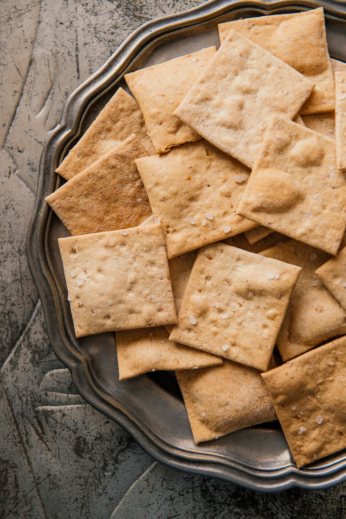 Load image into Gallery viewer, American Spoon Classic Crackers on a metal tray with a textured background
