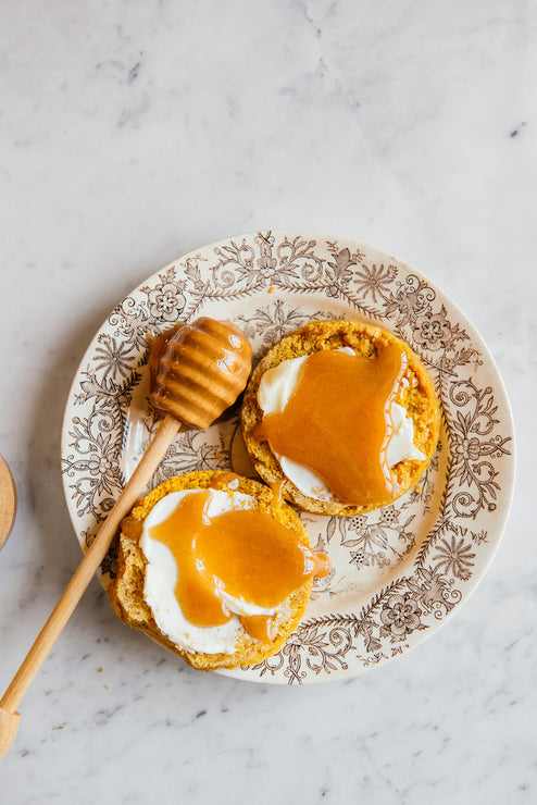 Load image into Gallery viewer, A biscuit slathered in butter and drizzled in Cinnamon Honey
