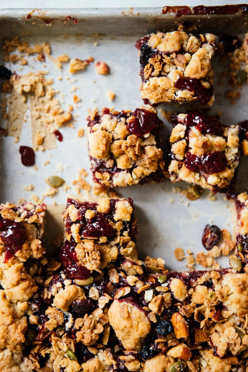 Load image into Gallery viewer, a tray of homemade granola bars with preserves
