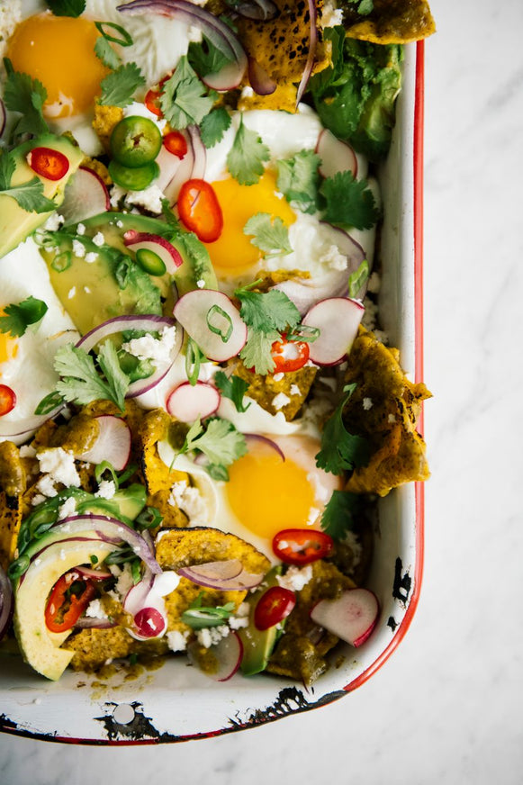 A pan of breakfast chiliquiles with Tomatillo Salsa