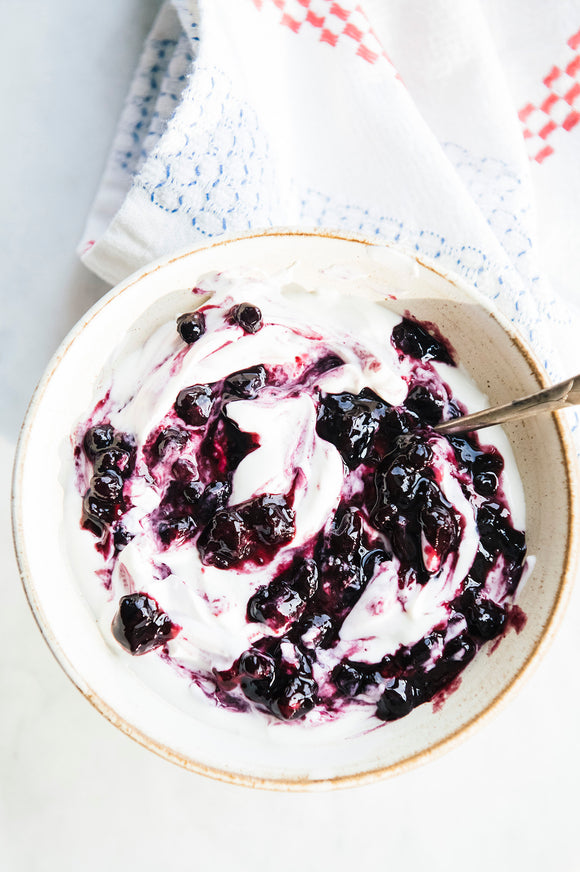 A yogurt bowl with Fruit Perfect Blueberries mixed in