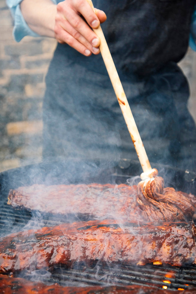 Grilling a rack of ribs made with American Spoon Grilling Sauce